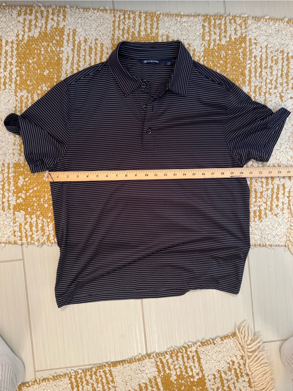 Cutter and buck navy blue polo with white stripes